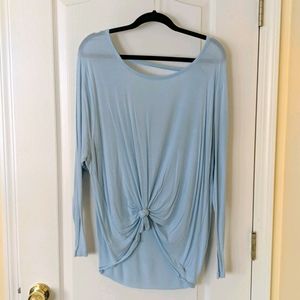 Blue opened back long sleeve top.